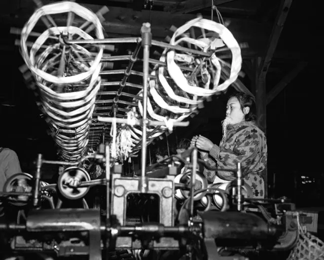 Interior of the silk mill in Japan showing the looms on April 4, 1944. All of the goods being processed are for reparations and souvenirs for the Allied occupation troops and shipment abroad. (Photo by Charles Gorry/AP Photo)