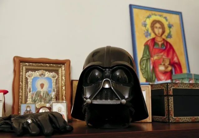 Darth Mykolaiovych Vader's Darth Vader helmet sits on a shelf among icons at his apartments in Odessa, December 2, 2015. (Photo by Valentyn Ogirenko/Reuters)