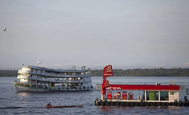 A floating gas station for small and medium vessels is seen in the middle of the Rio Negro river, near the Port of Panair in Manaus in Amazonas state, Brazil, January 7, 2015. (Photo by Bruno Kelly/Reuters)