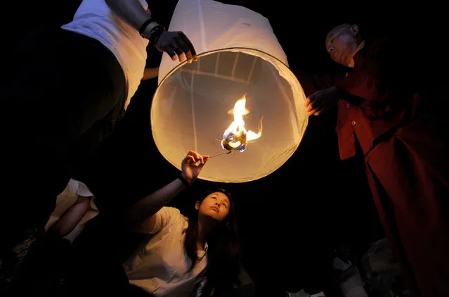 Buddhist devotees release lanterns into the air at Borobudur Temple during Vesak Day celebrations in Magelang, Central Java, Indonesia on June 04, 2023. (Photo by Dasril Roszandi/Anadolu Agency via Getty Images)