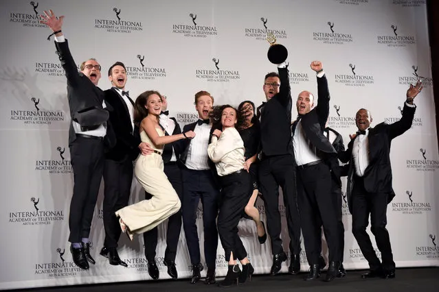 The production crew members from “Deutschland 83” and presenter Damian Lewis jump on stage in the press room with the International Emmy award in the Drama Series category in Manhattan, New York, U.S. November 21, 2016. (Photo by Mark Kauzlarich/Reuters)