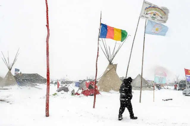 The Oceti Sakowin camp is seen in a snow storm during a protest against plans to pass the Dakota Access pipeline near the Standing Rock Indian Reservation, near Cannon Ball, North Dakota, U.S. November 28, 2016. (Photo by Stephanie Keith/Reuters)