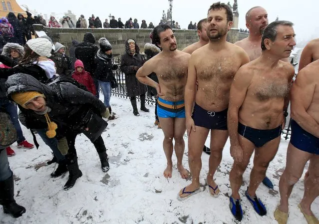 Participants prepare for the traditional Three Kings swim to commemorate Epiphany at the Vltava River in Prague, Czech Republic, January 6, 2016. (Photo by David W. Cerny/Reuters)