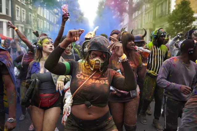 Early morning revellers celebrate Jouvertin Ladbroke Grove on August 26, 2018 as part of Notting Hill Carnival in London, England. The Notting Hill Carnival is recognised as Europe's biggest street festival. (Photo by Alex McBride/Getty Images)