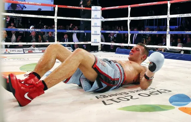 Martin Murray of England after being knocked down by World champion Gennadiy Golovkin of Kazakhstan during their WBA-WBC-IBO Middleweight World Championship fight in Monte Carlo, early February 22, 2015. Golovkin defended his title, defeating Murray in the 12 rounds. (Photo by Eric Gaillard/Reuters)