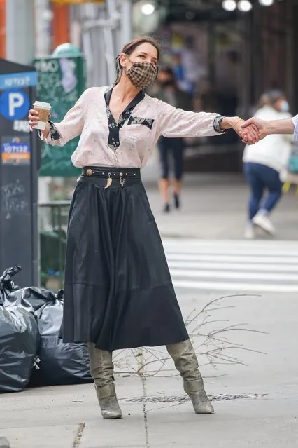 Actress Katie Holmes enjoys a walk in The Big Apple wearing a chic floral blouse paired with a leather skirt and booties on May 3, 2021. The actress turned her frown upside down after a coffee run. (Photo by Backgrid USA)