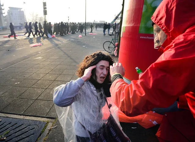 An activist reacts during a demonstration organized by the Blockupy movement to protest against the policies of the European Central Bank (ECB) after the ECB officially inaugurated its new headquarters earlier in the day on March 18, 2015 in Frankfurt, Germany. (Photo by Thomas Lohnes/Getty Images)