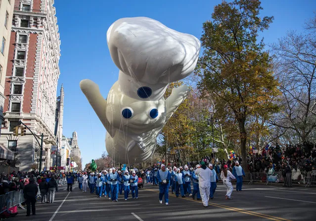 The Pillsbury Doughboy takes flight during the parade in New York on November 22, 2018. (Photo by Erik Thomas/NY Post)