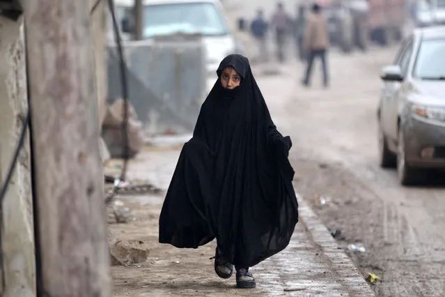A girl walks in al-Rai town, northern Aleppo countryside, Syria December 25, 2016. (Photo by Khalil Ashawi/Reuters)