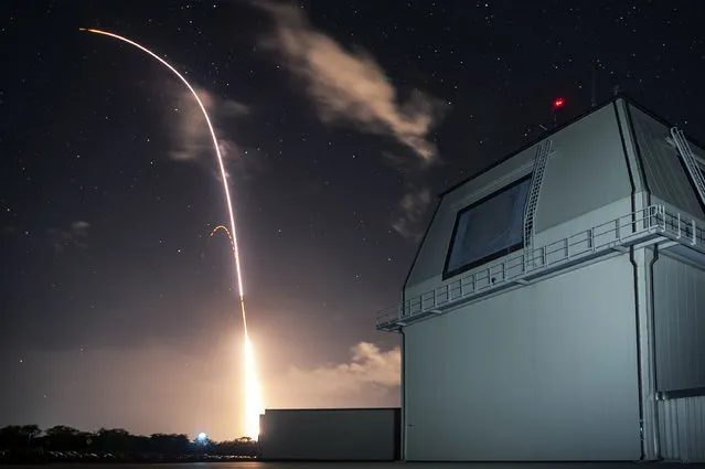 This Monday, December 10, 2018 photo provided by the U.S. Missile Defense Agency (MDA) shows the launch of the U.S. military's land-based Aegis missile defense testing system, that later intercepted an intermediate range ballistic missile, from the Pacific Missile Range Facility on the island of Kauai in Hawaii. The MDA said Monday's test showed an interceptor missile the military is developing with Japan that is ready to be manufactured. The Navy tracked it and launched an interceptor missile from Kauai. (Photo by Mark Wright/Missile Defense Agency via AP Photo)