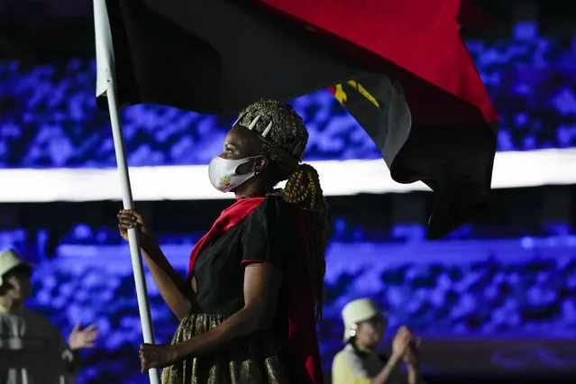 Natalia Santos of Angola, carry her country's flag during the opening ceremony in the Olympic Stadium at the 2020 Summer Olympics, Friday, July 23, 2021, in Tokyo, Japan. (Photo by Natacha Pisarenko/AP Photo)