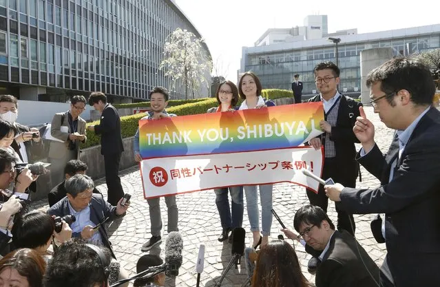 Lesbian activists Hiroko Masuhara (centre L) and her partner Koyuki Higashi (centre R) speak to the media with transgender activist Fumino Sugiyama (L) and gay activist Gon Matsunaka after Tokyo's Shibuya ward recognises same-s*x partnerships, outside the Shibuya city hall in Tokyo in this photo taken by Kyodo March 31, 2015. (Photo by Reuters/Kyodo News)