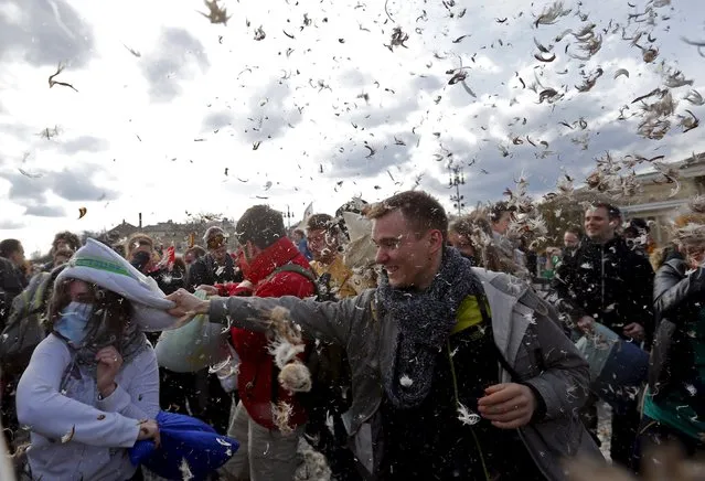 People fight with pillows during International Pillow Fight Day at Heroes Square in Budapest April 4, 2015. (Photo by Laszlo Balogh/Reuters)