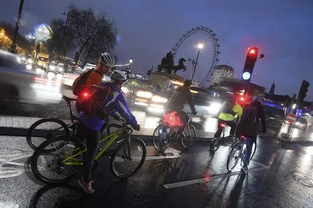 Commuters on bicycles wait at traffic lights next to Westminster Bridge during a strike on the Underground by members of two unions in protest at ticket office closures and reduced staffing levels, in London, Britain January 9, 2017. (Photo by Toby Melville/Reuters)