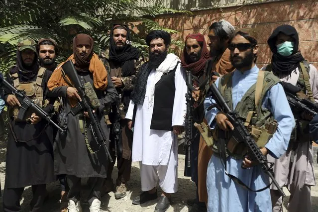 Taliban fighters pose for photograph in Wazir Akbar Khan in the city of Kabul, Afghanistan, Wednesday, August 18, 2021. (Photo by Rahmat Gul/AP Photo)