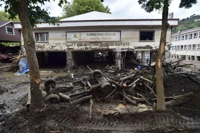 Photo shows the destruction after floods and mudslides killed about three dozens of people, in Bozkurt town of Kastamonu province, Turkey, Friday, August 13, 2021. (Photo by AP Photo/Stringer)