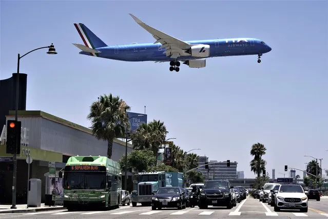 An ITA Airways passenger jet approaches to land at the Los Angeles International Airport in Los Angeles, on July 1, 2022. German airline Lufthansa on Thursday, May 25, 2023, signed a deal with the Italian government for a minority share in the long-struggling ITA Airways, formerly Alitalia. Lufthansa’s industrial plan calls for revenues of 2.5 billion euros ($2.68 billion) this year, growing to 4.1 billion euros in 2027, the Italian Finance Ministry said in a statement. No financial terms were disclosed. (Photo by Jae C. Hong/AP Photo)