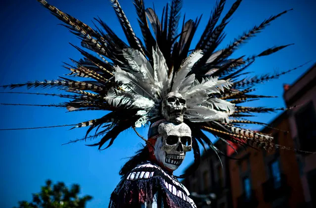 A Mexican indigenous man takes part in a ceremony of purification at the Zocalo square, in Mexico City on February 10, 2019. (Photo by Ronaldo Schemidt/AFP Photo)