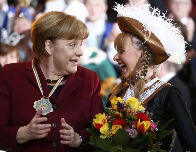 German Chancellor Angela Merkel and Sarah Philips during a reception of German carnival societies at the Chancellery in Berlin, Germany, January 23, 2017. (Photo by Hannibal Hanschke/Reuters)