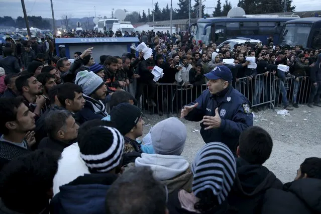 Migrants who are waiting to cross the Greek-Macedonian border, gather to receive travel documents near the village of Idomeni, Greece, March 3, 2016. (Photo by Marko Djurica/Reuters)