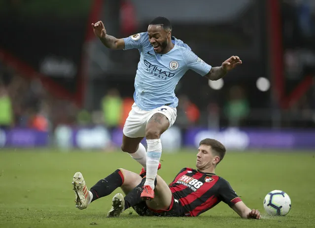 Bournemouth's Chris Mepham tackles Manchester City's Raheem Sterling, during the English Premier League soccer match between Bournemouth and Manchester City,  at the Vitality Stadium, in  Bournemouth, England, Saturday March 2, 2019. (Photo by Adam Davy/PA Wire via AP Photo)