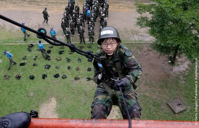 South Korean teenagers participate in a warfare exercise as part of the Special Warfare Command's training course at a military base