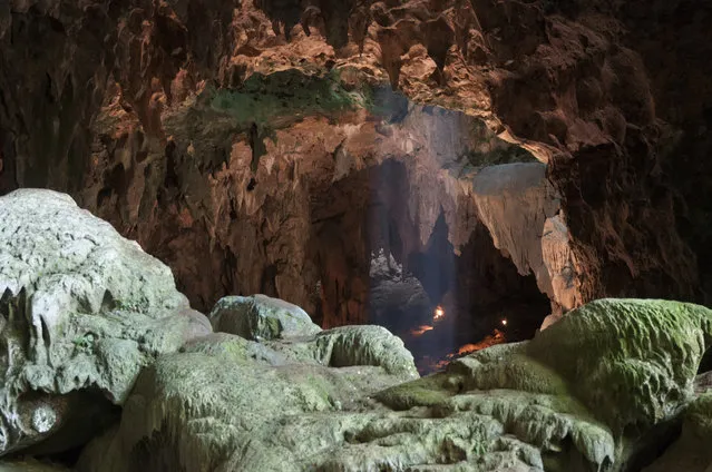 This undated photo provided by the Callao Cave Archaeology Project in April 2019 shows Callao Cave on Luzon Island of the Philippines, where the fossils of Homo luzonensis were discovered. This view is taken from the rear of the first chamber of the cave, where the fossils were found, in the direction of the second chamber. In a study released on Thursday, April 10, 2019, scientists report that tests on two samples from the species show minimum ages of 50,000 years and 67,000 years. (Photo by Callao Cave Archaeology Project via AP Photo)