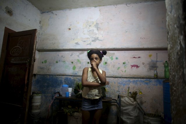 Marcia Sanchez, 7, niece of Yolanda Sanchez, (not pictured), stands in her home in Havana, March 19, 2016. (Photo by Alexandre Meneghini/Reuters)