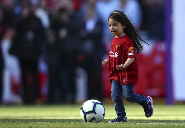 Makka, age 5, the daughter of Liverpool's Mohamed Salah, not pictured, kicks the ball at the end of the English Premier League soccer match between Liverpool and Wolverhampton Wanderers at the Anfield stadium in Liverpool, England, Sunday, May 12, 2019. Despite a 2-0 win over Wolverhampton Wanderers, Liverpool missed out on becoming English champion for the first time since 1990 because title rival Manchester City beat Brighton 4-1. (Photo by Dave Thompson/AP Photo)