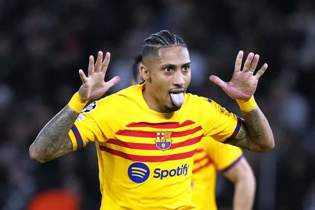 Barcelona's Raphinha celebrates after scoring his side's opening goal during the Champions League quarterfinal first leg soccer match between Paris Saint-Germain and Barcelona at the Parc des Princes stadium in Paris, Wednesday, April 10, 2024. (Photo by Lewis Joly/AP Photo)