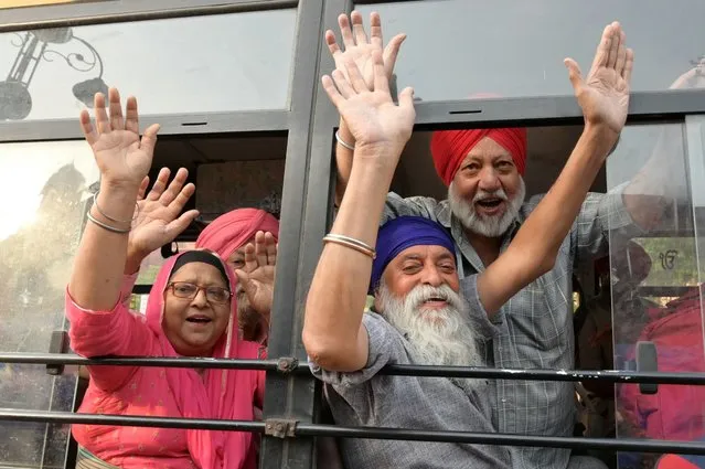 Sikh pilgrims chant slogans as they leave for Pakistan to celebrate “Baisakhi”, a spring harvest festival, in Amritsar on April 13, 2024. (Photo by Narinder Nanu/AFP Photo)