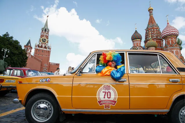 A vintage car before the 2019 GUM Motor Rally featuring classic cars in Moscow, Russia on July 28, 2019. The GUM AutoRally has been held annually since 2014 and is the largest and most important retro car competition in Russia. (Photo by Artyom Geodakyan/TASS via Getty Images)