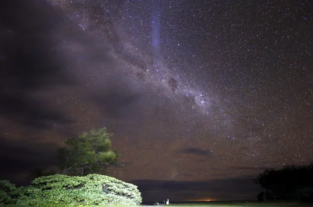 The Milky Way is seen in the sky above a path and huts on Lady Elliot Island located north-east of the town of Bundaberg in Queensland, Australia, June 10, 2015. (Photo by David Gray/Reuters)