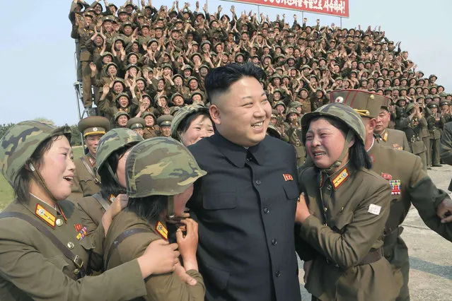 North Korean leader Kim Jong Un is seen as he guides the multiple-rocket launching drill of women's sub-units under KPA Unit 851, in this undated photo released by North Korea's Korean Central News Agency (KCNA) April 24, 2014. (Photo by Reuters/KCNA)