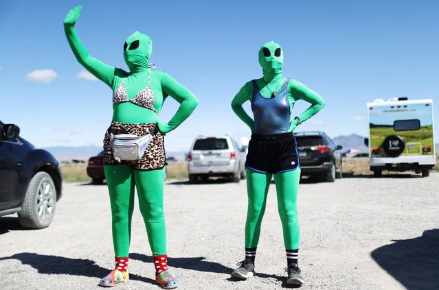 Women are dressed as aliens at a “Storm Area 51” spinoff event called “Alienstock” on September 20, 2019 in Rachel, Nevada. The event is a spinoff from the original “Storm Area 51” Facebook event which jokingly encouraged participants to charge the famously secretive Area 51 military base in order to “see them aliens”. Two tiny desert towns not far from from the once-secret Area 51 are hosting related events this weekend. The military has warned attendees not to approach the protected Area 51 military installation. (Photo by Mario Tama/Getty Images)