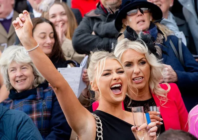 Race goers react during the EFT construction Handicap Hurdle race during Grand National Day at the Randox Grand National Festival at Aintree, Liverpool, Britain, 09 April 2022. (Photo by Peter Powell/EPA/EFE)