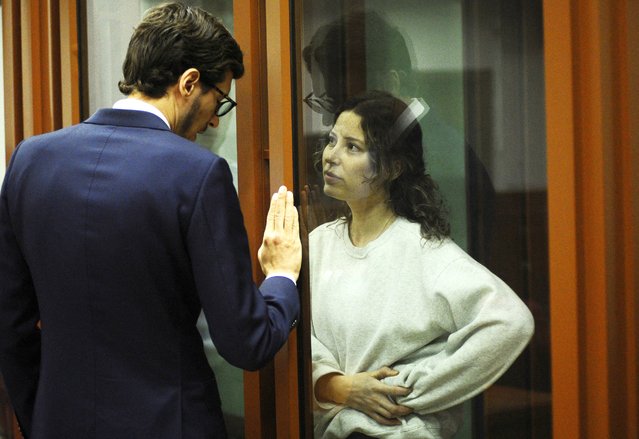 Ksenia Karelina, a Russian-American dual citizen, speaks with her lawyer, Mikhail Mushailov, at a court hearing in Yekaterinburg, Russia on August 15, 2024. A Russian court found her guilty of treason and sentenced her to 12 years in prison over a $50 donation to a Ukrainian charity. (Photo by Dmitry Chasovitin/Reuters)