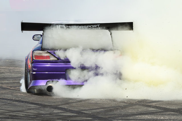 A stunt driver takes part in a drifting exhibition during the first day of the British Motor Show at Farnborough International Exhibition Centre on August 17, 2023 in Farnborough, England. The UK's premier family-friendly automotive extravaganza is back with its annual showcase, featuring supercar parades, stunt shows, live auctions, expert advice on sustainable motoring options, and giving speed enthusiasts the chance to test drive the latest models. (Photo by Leon Neal/Getty Images)