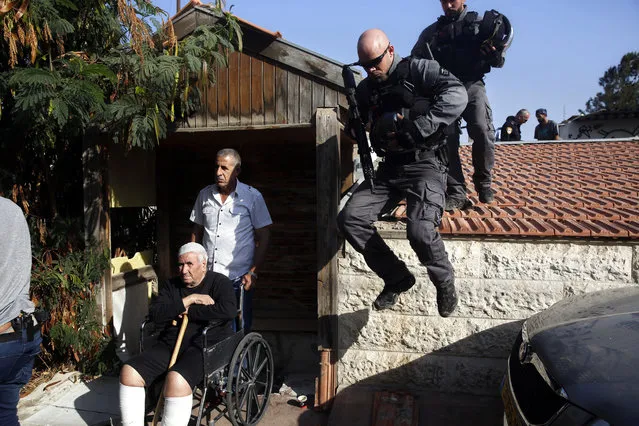 Israeli police officers evacuate a Palestinian member of the Shamasneh family in east Jerusalem Tuesday, September 5, 2017. Israeli officials have evicted a Palestinian family from their home in east Jerusalem to make way for new Jewish tenants. (Photo by Mahmoud Illean/AP Photo)