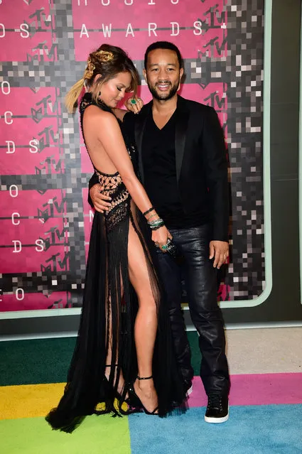 Model Chrissy Teigen (L) and recording artist John Legend attend the 2015 MTV Video Music Awards at Microsoft Theater on August 30, 2015 in Los Angeles, California. (Photo by Frazer Harrison/Getty Images)