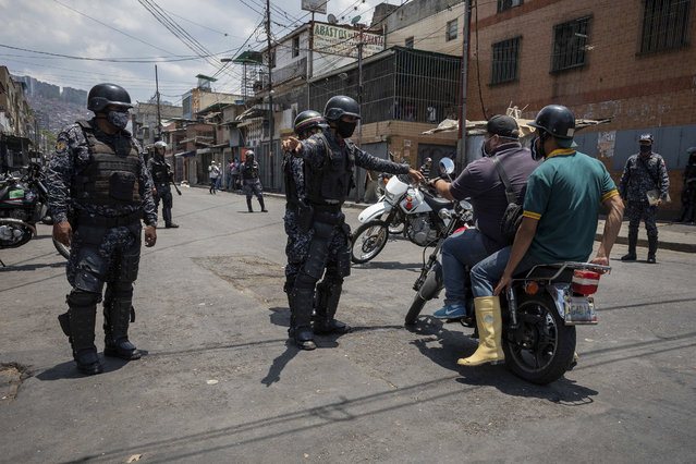Members of the Bolivarian National Police enforce the closing of businesses and the fulfillment of quarantine, around Catia market in Caracas, Venezuela, 16 April 2020. Countries around the world are taking increased measures to stem the spread of the SARS-CoV-2 coronavirus which causes the Covid-19 disease. (Photo by Rayner Penar/EPA/EFE/Rex Features/Shutterstock)