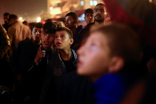 Palestinians react as they wait for news of a ceasefire deal with Israel, in Khan Younis in the southern Gaza Strip, on January 15, 2025. (Photo by Mohammed Salem/Reuters)