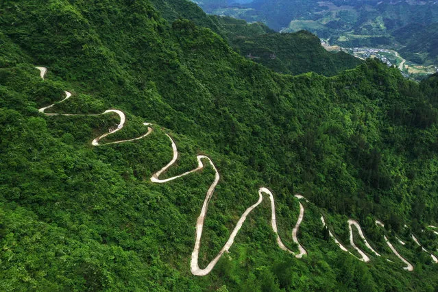 Aerial view of a winding road in the remote mountains on May 14, 2020 in Chongqing, China. (Photo by Yang Min/VCG via Getty Images)