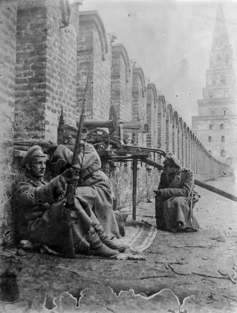 In this photo taken in October 1917, provided by Russian State Documentary Film and Photo Archive, junkers get ready at their position atop of the Kremlin Wall in Moscow, Russia. The 1917 Bolshevik Revolution was long before the digital revolution allowed anyone to instantly document events. But the clumsy cameras of the time still caught some images that capture the period's drama. (Photo by Russian State Documentary Film and Photo Archive via AP Photo)