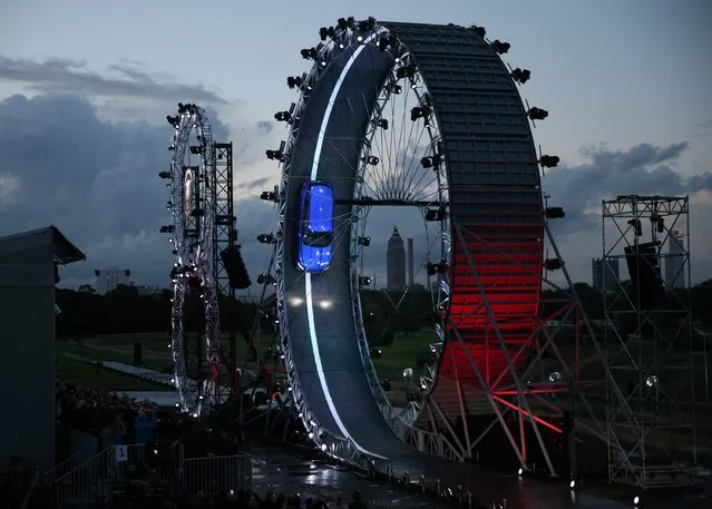 The Jaguar F-PACE is unveiled as it drives round a giant loop the loop track on September 14, 2015 in Frankfurt, Germany. Jaguar is celebrating it's 80th year by revealing the new F-PACE car a to global audience, ahead of it's Motor Show debut in Frankfurt. Earlier the F-PACE beat the Guinness World Record for largest loop the loop drive in a car. (Photo by Peter Macdiarmid/Getty Images for Jaguar)
