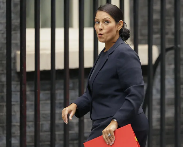 In this Tuesday, October 10, 2017 file photo, Britain's Secretary of State for International Development Priti Patel reacts to a question from the media as she arrives for a cabinet meeting at 10 Downing Street in London. Running for election mere months ago, British Prime Minister Theresa May's slogan was “strong and stable government”. The phrase sounds cruelly ironic now, with several senior members of May's Cabinet under fire for missteps or under investigation for alleged sexual misconduct. The latest bad news came when it emerged this week that International Development Secretary Priti Patel held 12 meetings with Israeli groups and officials, including Prime Minister Benjamin Netanyahu, while she was on vacation in the country in August – and that she hadn't told the prime minister or colleagues about it. (Photo by Alastair Grant/AP Photo)