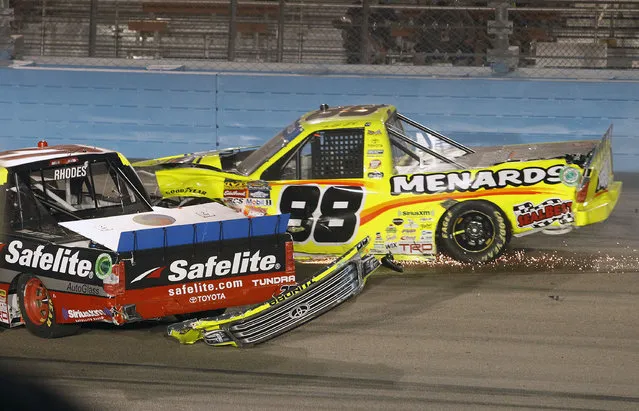 Matt Crafton (88) and Ben Rhodes crash after a restart during a NASCAR Trucks series auto race at Phoenix International Raceway, Friday, November 10, 2017, in Avondale, Ariz. (Photo by Ralph Freso/AP Photo)