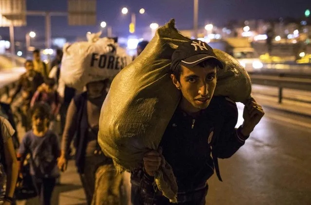 Syrian migrants walk on a motorway to reach the Greek border after they left from the main bus terminal in Istanbul, Turkey, September 21, 2015. Hundreds of migrants attempt to walk from Istanbul to the western city of Edirne, on Turkey's Greek border. (Photo by Huseyin Aldemir/Reuters)