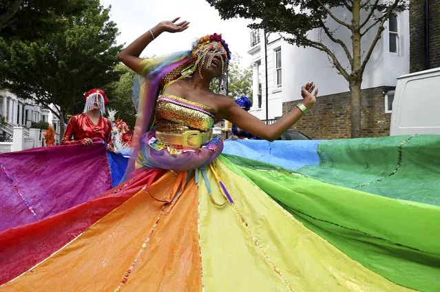 A performer joins in the celebrations during the Notting Hill Carnival on August 29, 2016 in London, England. (Photo by Ben A. Pruchnie/Getty Images)