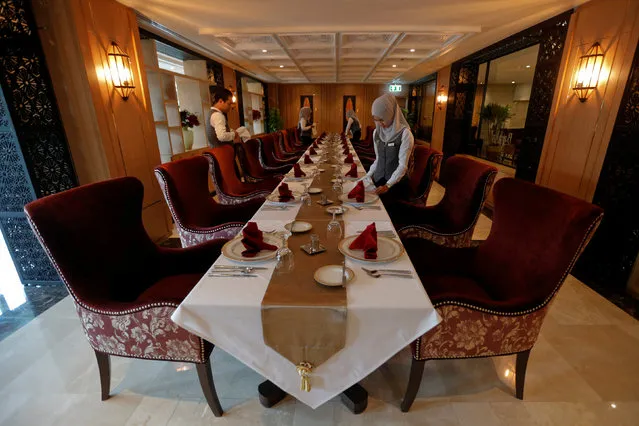 Muslim employees arrange a table at the Al Meroz hotel in Bangkok, Thailand, August 29, 2016. (Photo by Chaiwat Subprasom/Reuters)